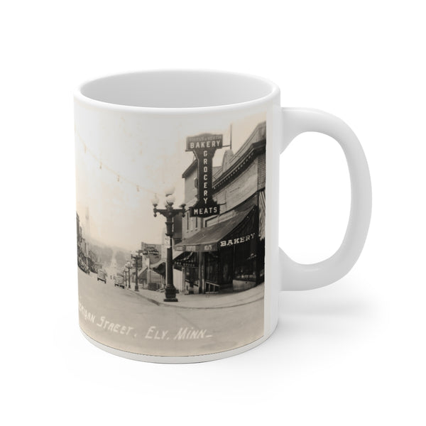 Nice view of Sheridan Street in downtown Ely, Minnesota from 1938, White Ceramic Mug