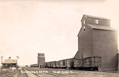 Elevators and Railroad Depot, Frost, Minnesota, 1925 Postcard Reproduction